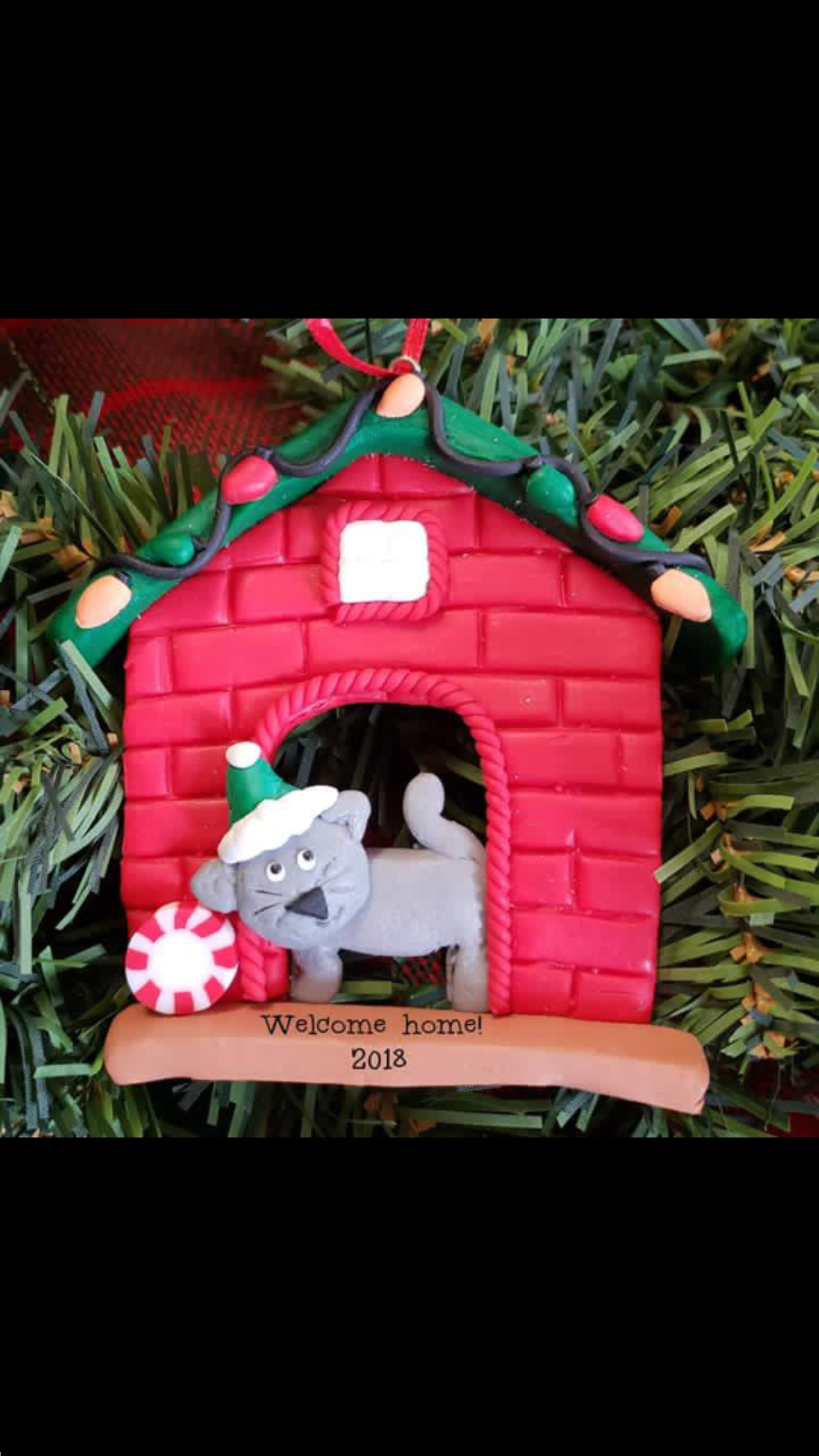Cat by fireplace ornament